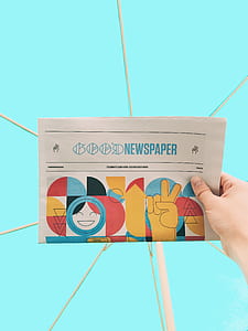 person holding newspaper thumbnail