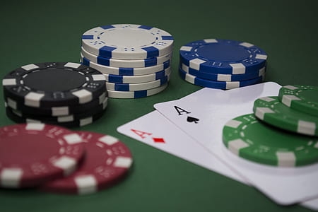 close-up photo of poker chip and playing cards thumbnail