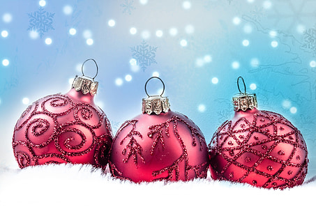 three Christmas baubles on white rug thumbnail