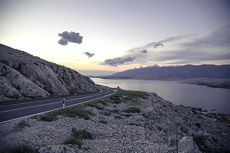 road near body of water thumbnail