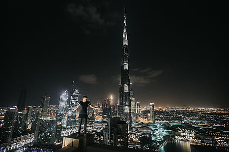 man standing on side of roof top thumbnail