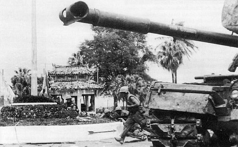 U.S. Marines advance past an M48 Patton tank during the battle for Huế during Vietnam War thumbnail