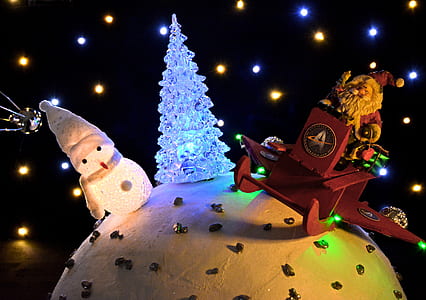 snowman, LED Christmas tree, and Santa Claus decors thumbnail