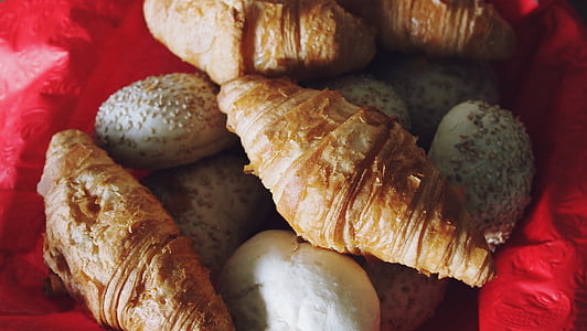 bread with sesame seeds on red textile thumbnail