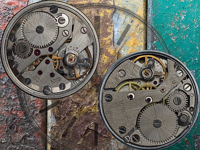 two round gray skeleton watches thumbnail