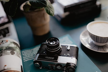 Old analog camera and photography book thumbnail