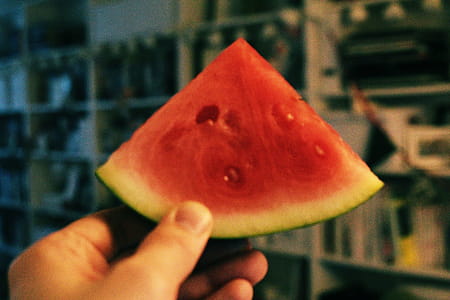 Person Holding Sliced Watermelon thumbnail