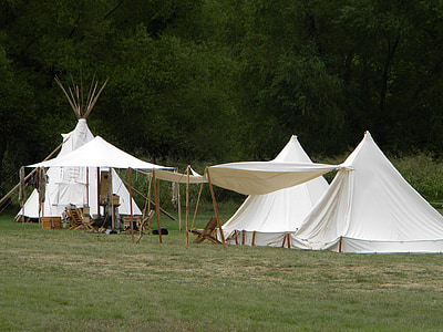 three white teepee tents thumbnail