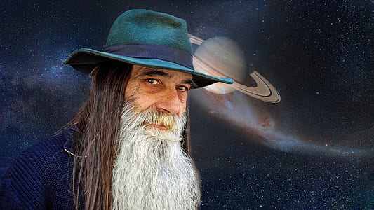 man in blue hat with planet background thumbnail