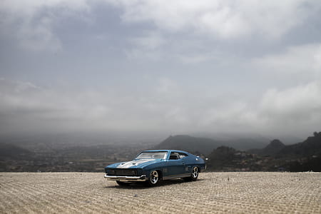 photography of blue Ford Mustang Mach 1 thumbnail