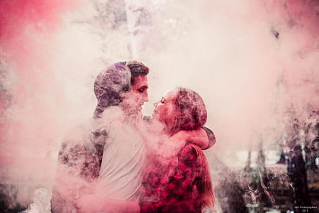 man and woman facing each other surrounded with smoke thumbnail