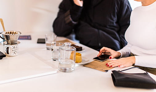 woman sitting on chair holding smartphone thumbnail