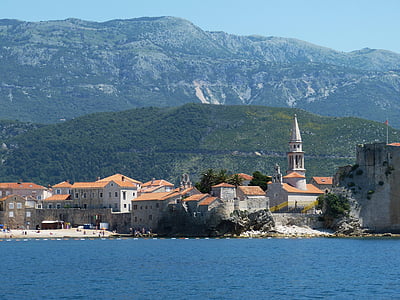 green mountain and orange houses thumbnail