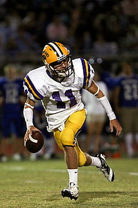 football player holding football thumbnail