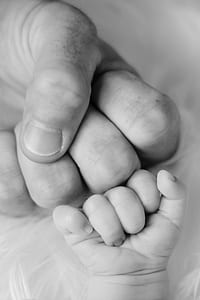 grayscale photo of two human hands thumbnail