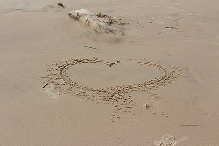 heart shape marked on sand at daytime thumbnail
