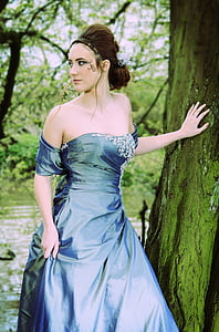 woman in blue cold-shoulder dress thumbnail
