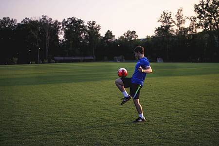 man playing soccer on field thumbnail