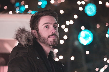 man wearing black parka coat thumbnail