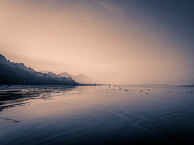 body of water near mountain thumbnail