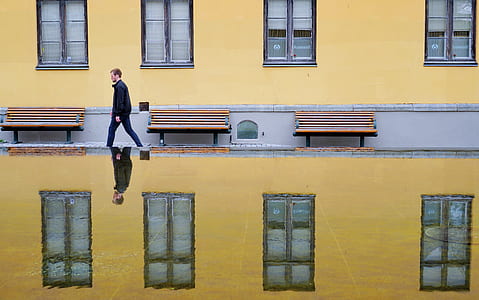 man walking sidewalk thumbnail