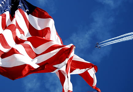 low angle photography of flag of U.S.A. during daytime thumbnail