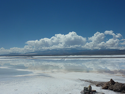 body of water under cloudy sky thumbnail