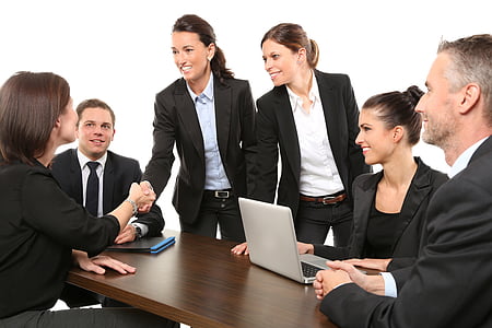 group of people beside brown table thumbnail