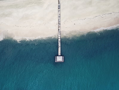 bird's eye photo of dock bay surrounded by body of water thumbnail