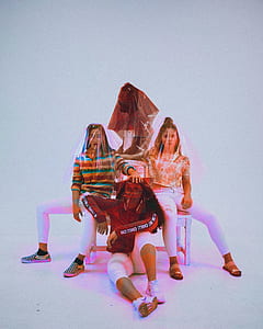 three persons with face covered in plastic thumbnail