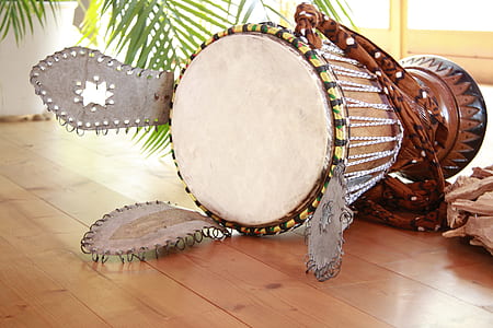 brown wooden djembe on brown floor thumbnail