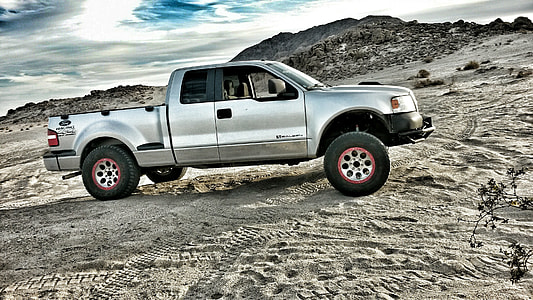 gray Ford F-150 extra cab pickup truck on gray road at daytime thumbnail