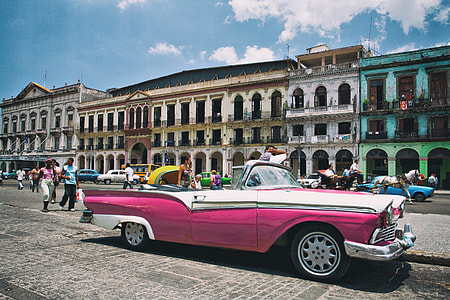 A pink Cadillac car sits on the colourful and vibrant streets of Havana in Cuba, the unofficial capital of Latin America. This image was captured with a Canon DSLR thumbnail