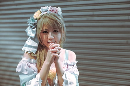 woman wearing floral headdress and white off-shoulder top thumbnail