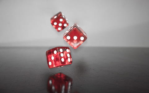 three dice on black surface thumbnail