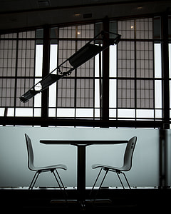 empty two chairs with table inside room photo thumbnail