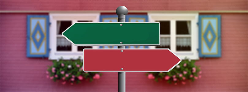 macro photography of green and red arrow signage thumbnail