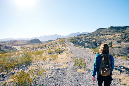 woman standing on gray road thumbnail