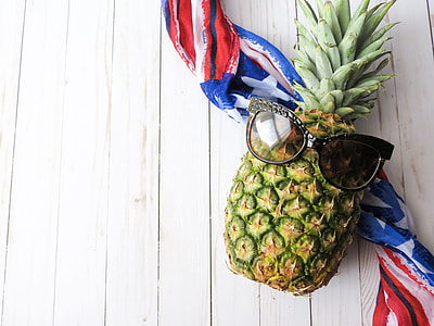 green and yellow pineapple fruit on blue and red scarf thumbnail