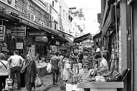 Grayscale Photo of People in the Market thumbnail