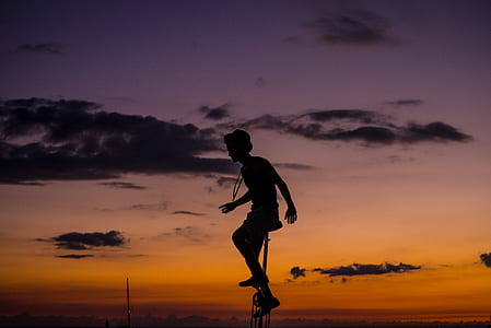 silhouette of a unicyclist during golden hour thumbnail