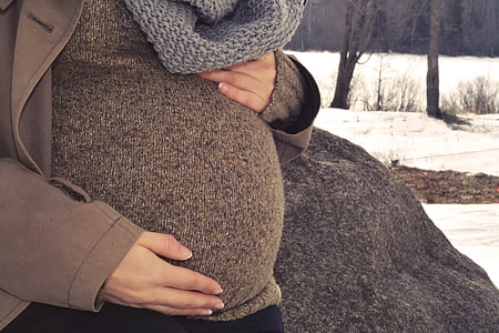 woman holding her tummy thumbnail
