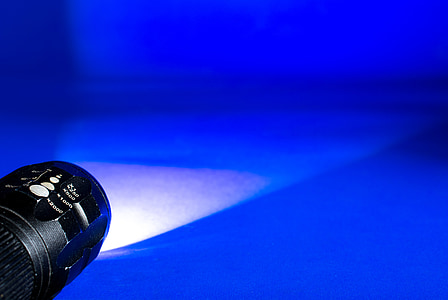 black flashlight on floor thumbnail