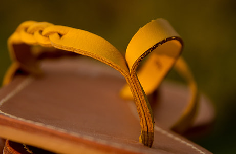 selective focus photography of brown sandal thumbnail