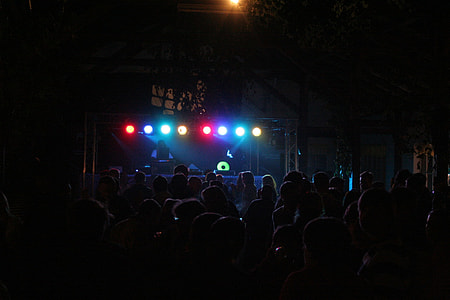 people watching person performing on stage thumbnail