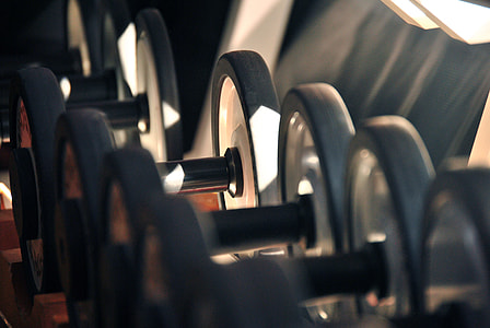 focus photo of dumbbells thumbnail