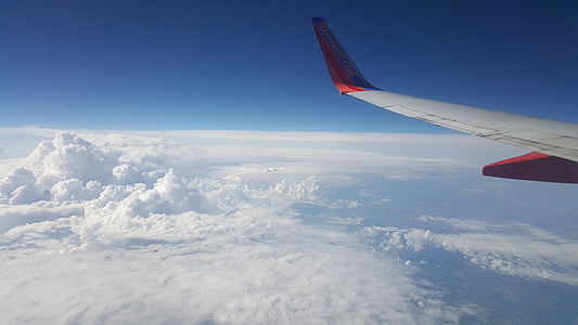 aerial photography of red and white plane view from plane window thumbnail