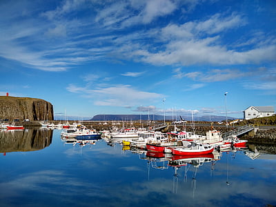 boats in calm water near dock thumbnail