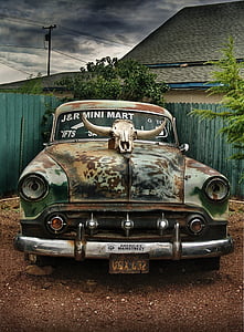 classic green coupe beside tree thumbnail