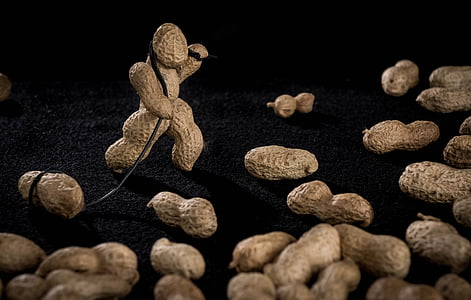 bunch of peanuts on black surface thumbnail